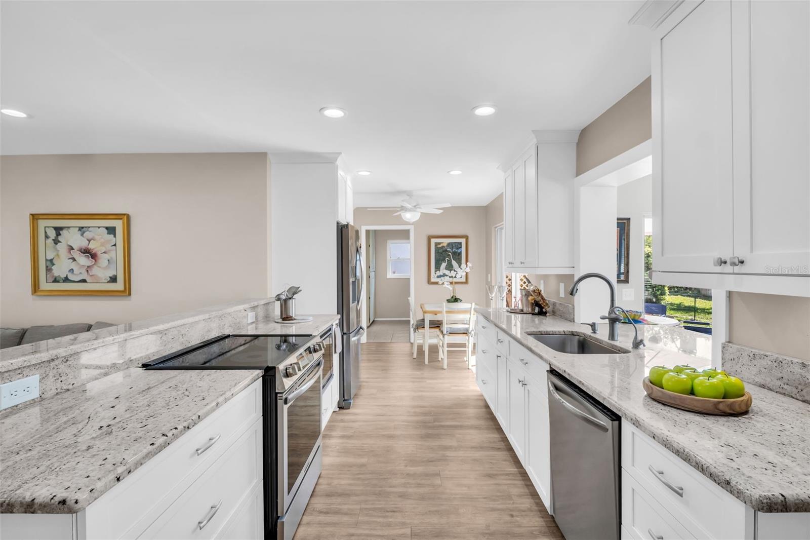 Eat-in kitchen space with glass slider access to private back patio~