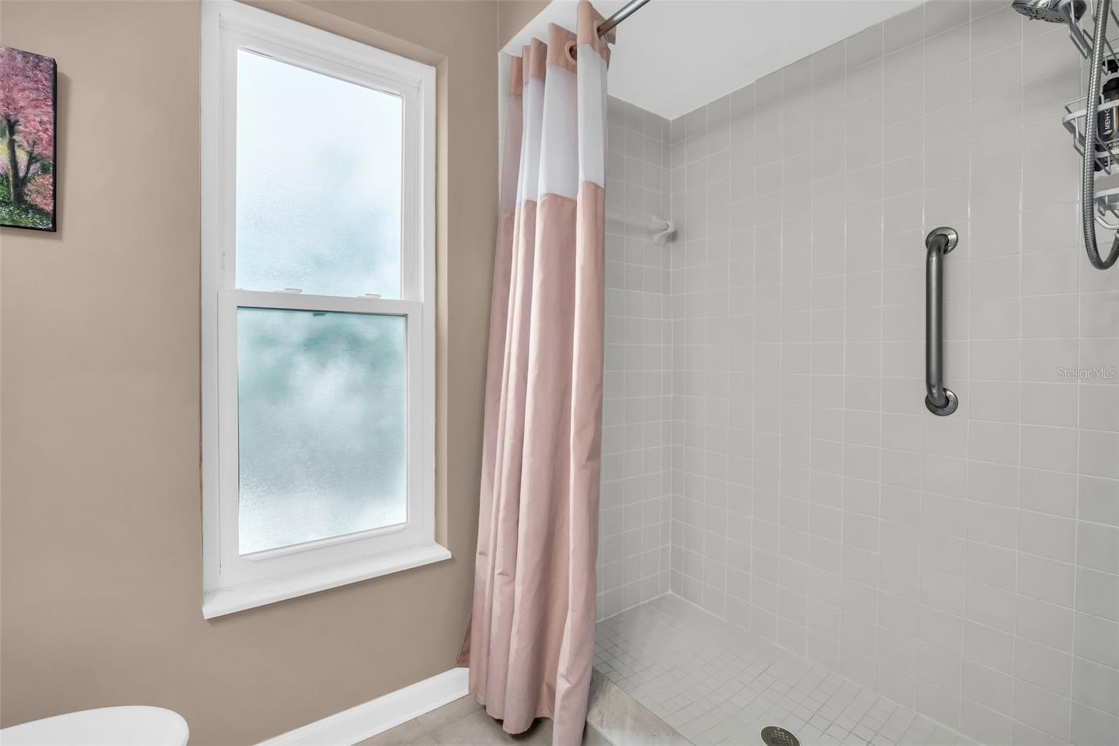Updated walk-in shower and grab bar for safety~