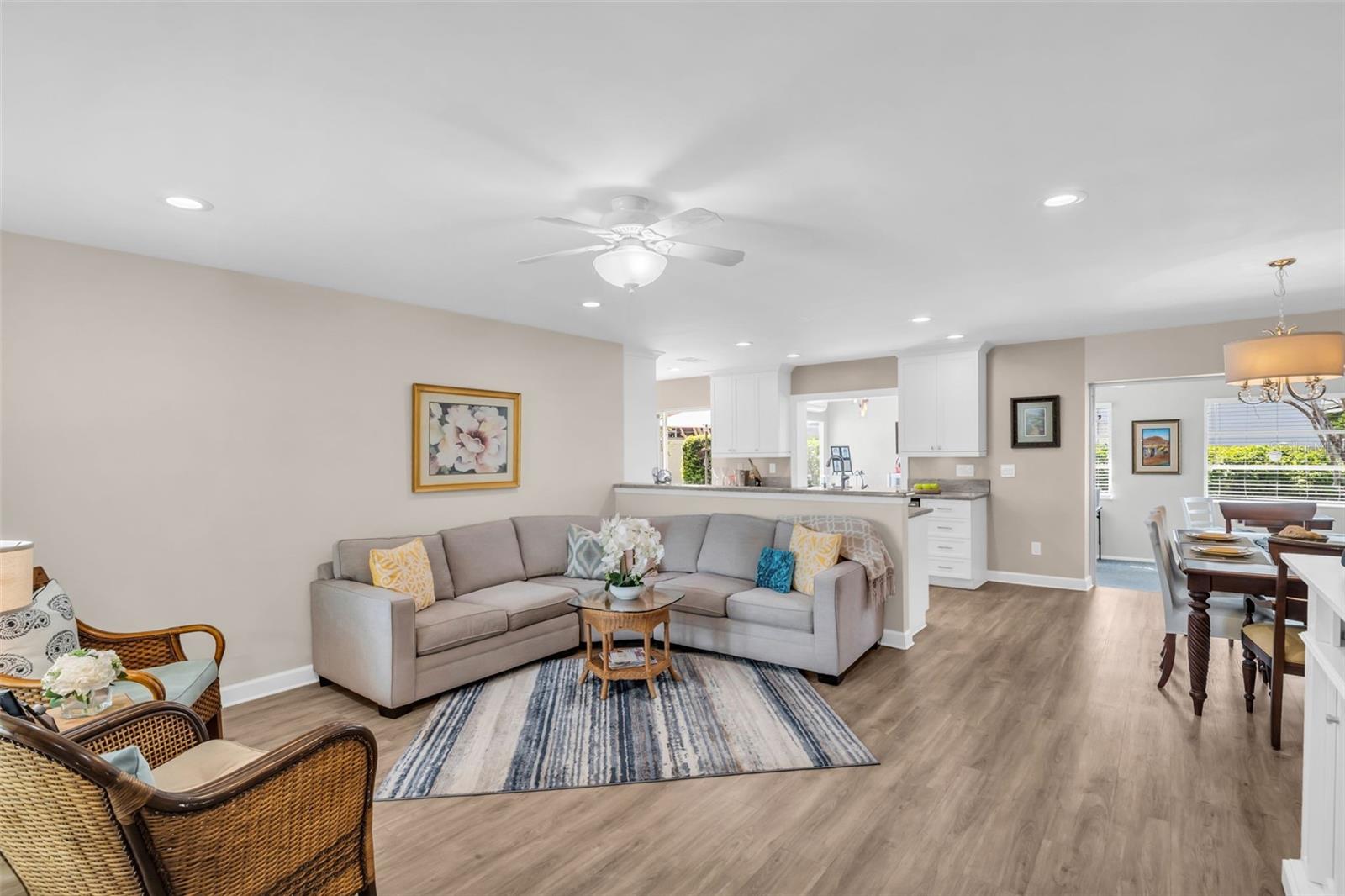 Open concept main living, no popcorn ceiling, and tasteful recessed lighting~
