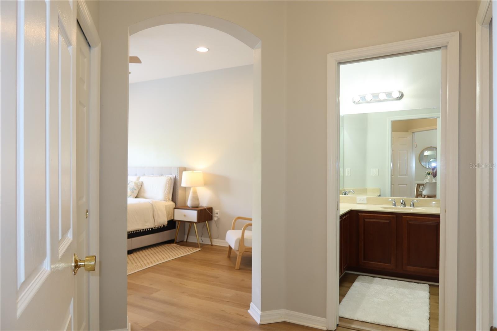 Primary Bedroom entrance - 2 closets and Bathroom access