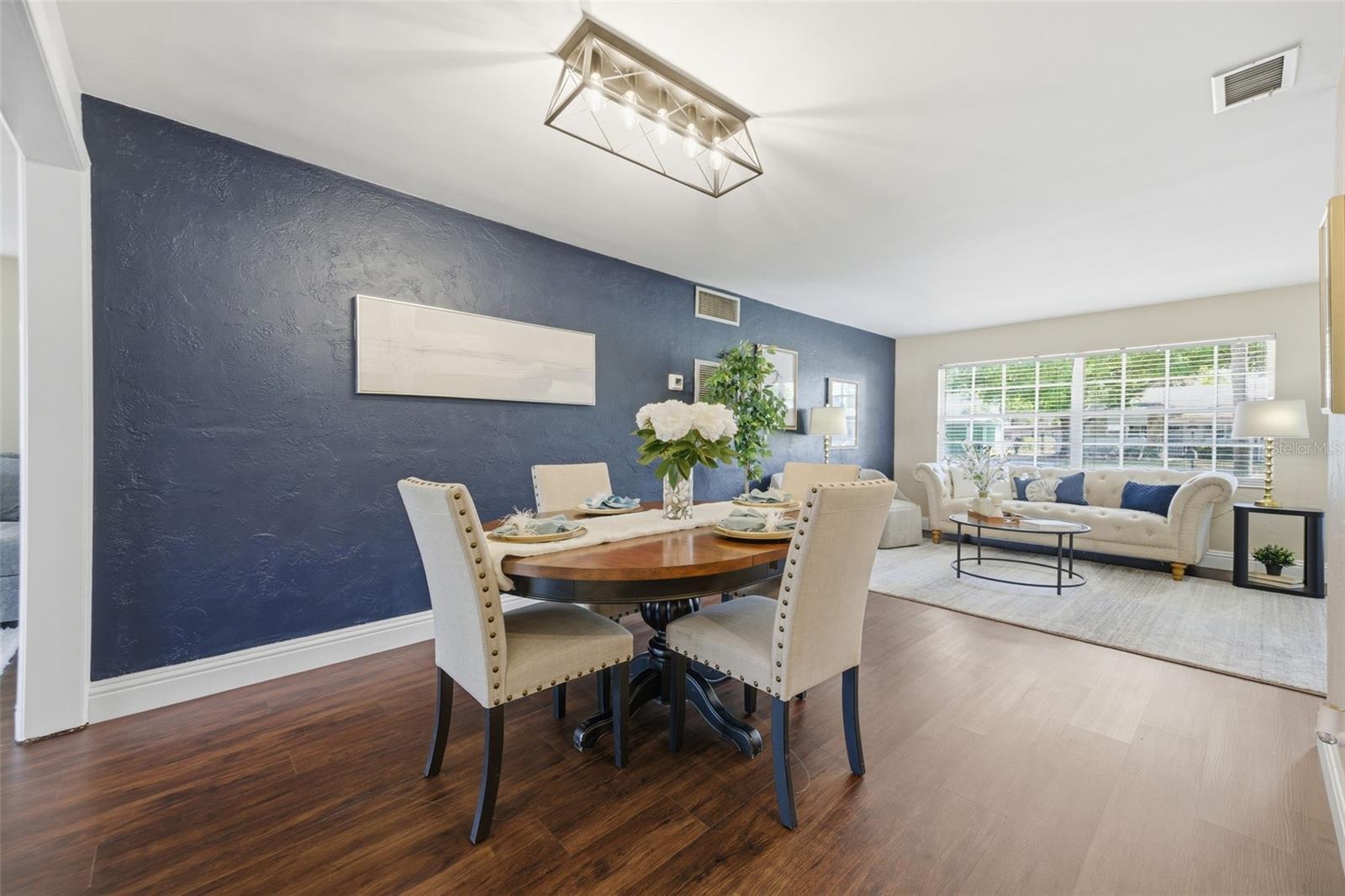 Dining room with view towards front door to formal living room.