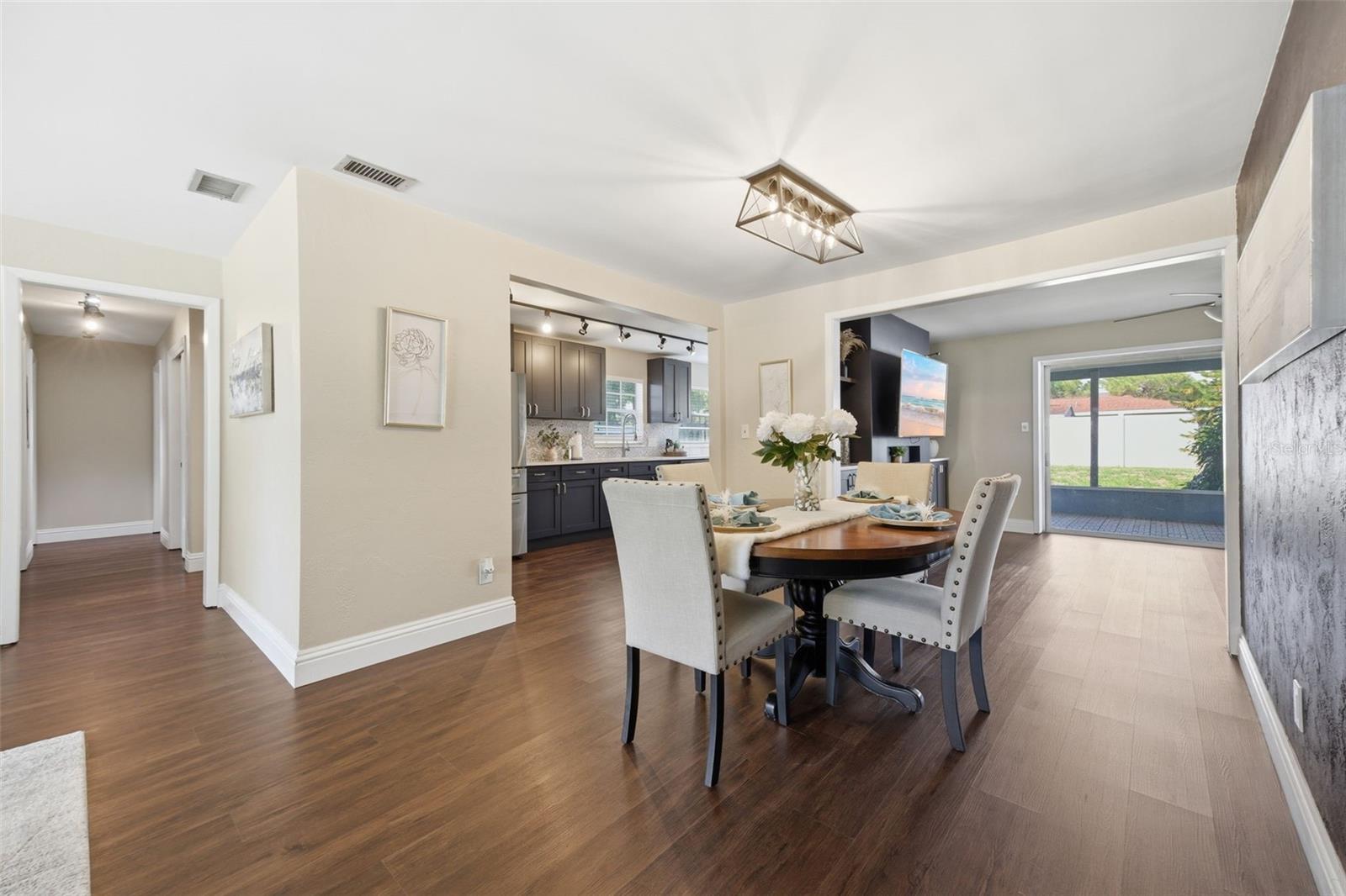 View of dining room of hallway to bedrooms and family room.