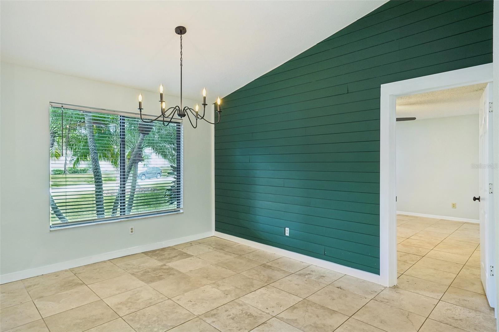 Dining room and door to primary bedroom.