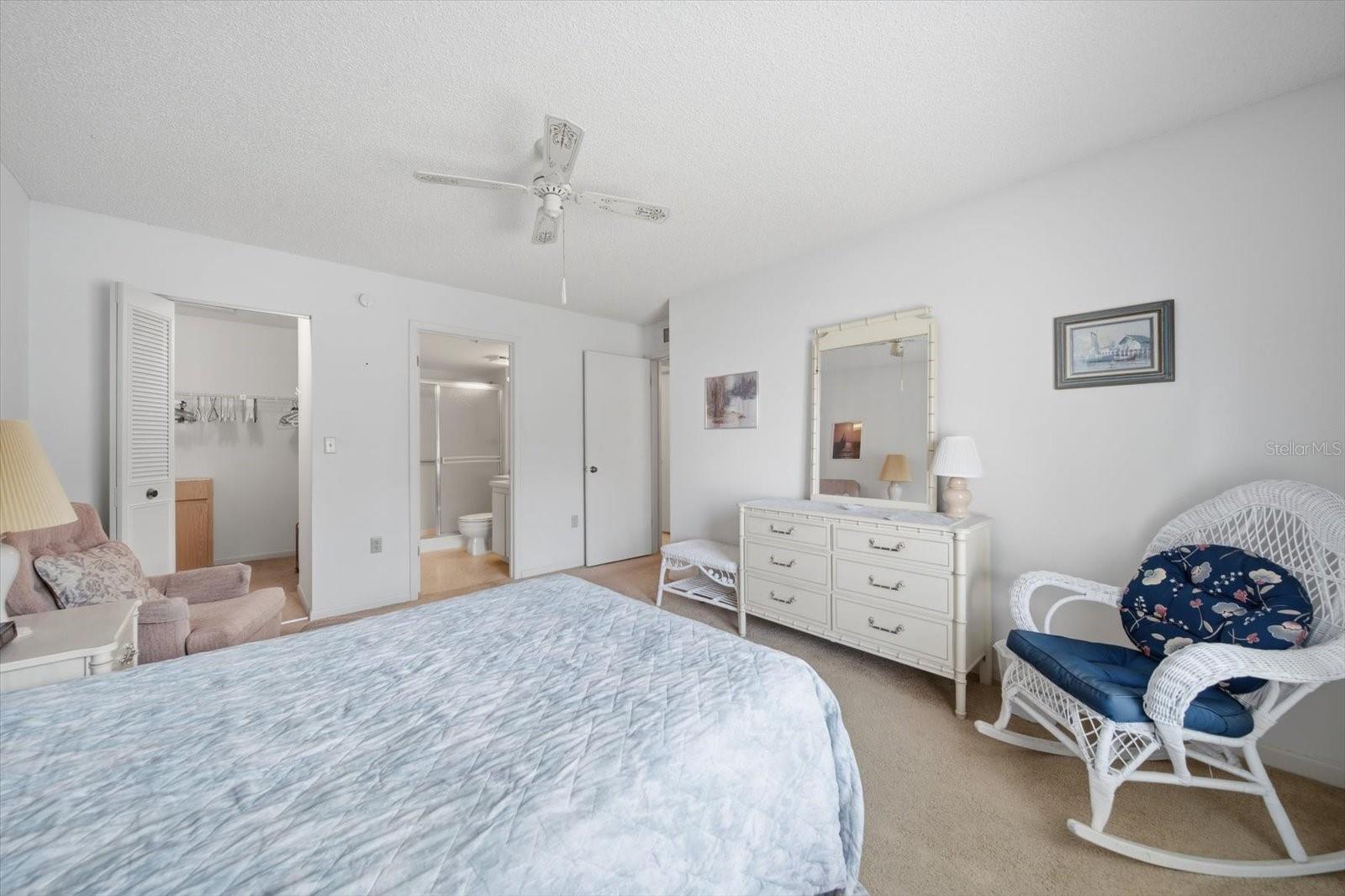 Primary bedroom with walk in closet and ensuite bathroom