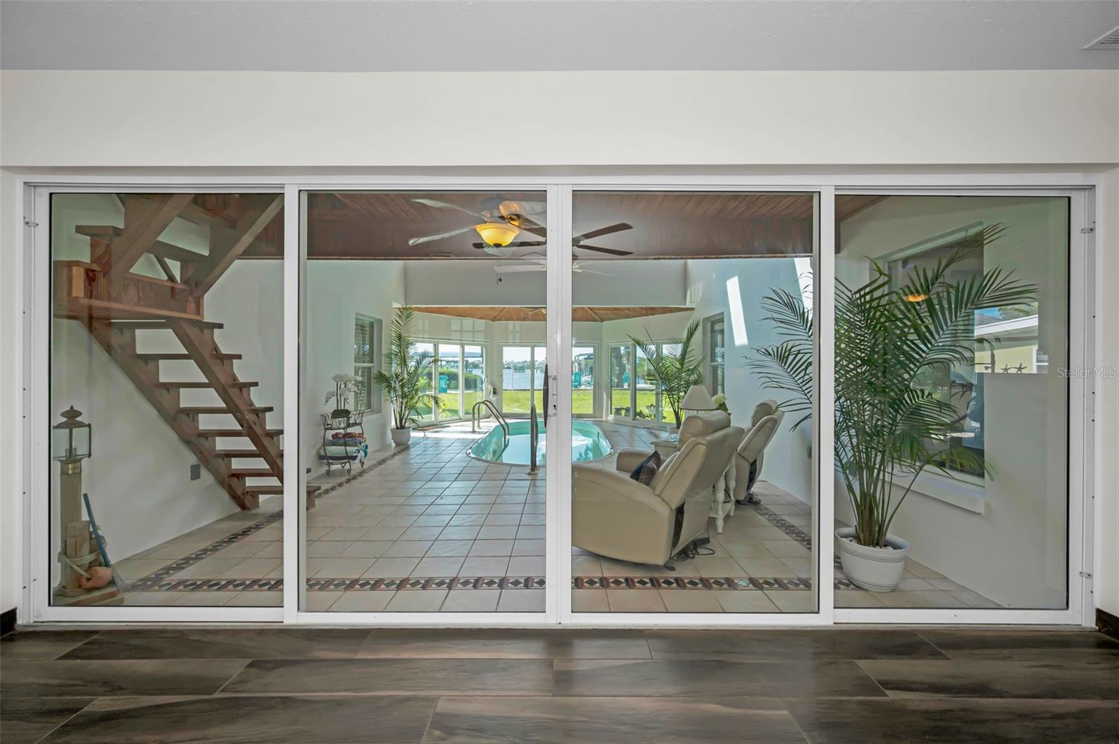 These sliders can be open or closed. Pool area in under A/C