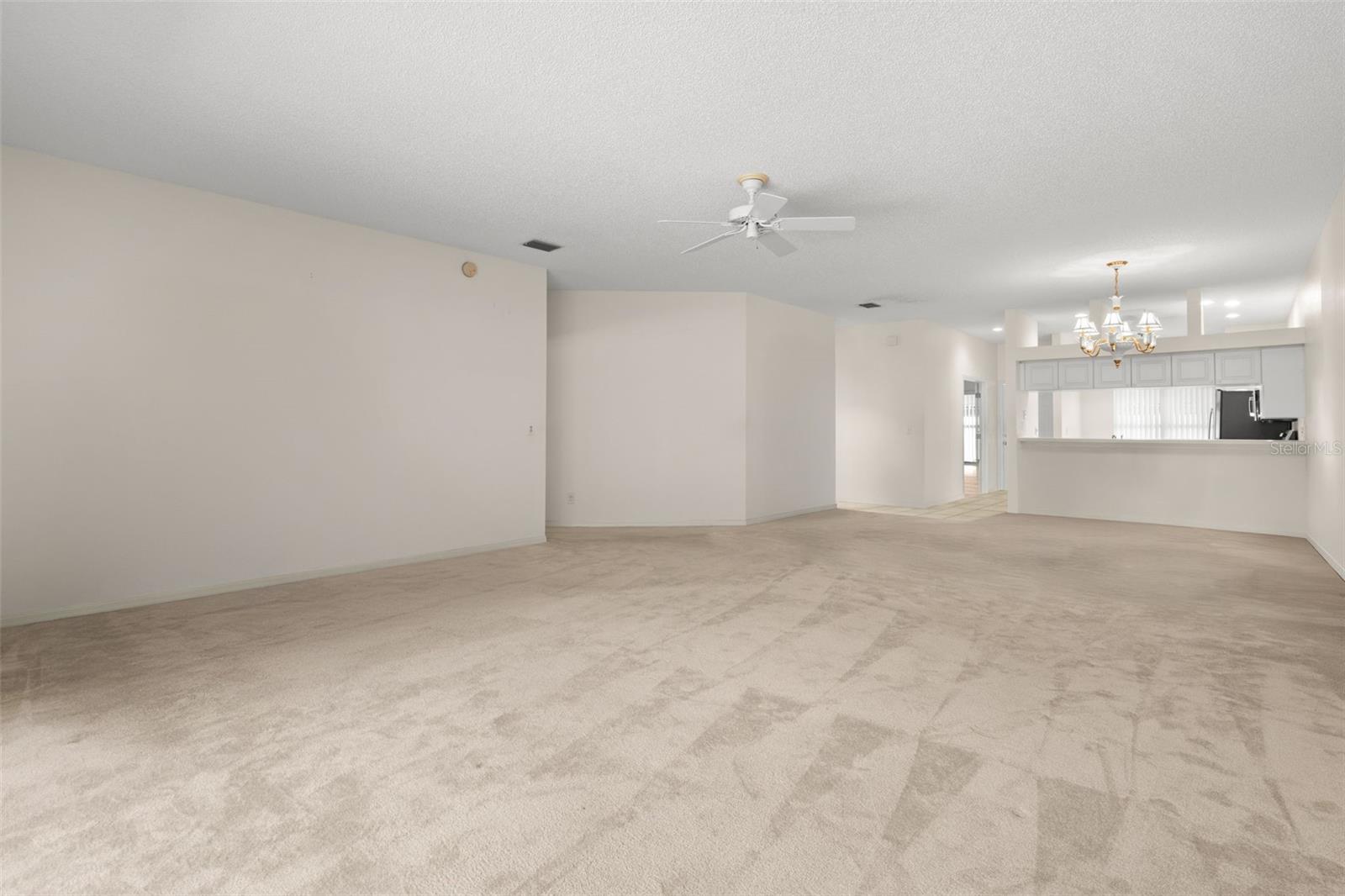 Spacious living and dining areas with an open connection to the kitchen, creating an easy flow for both daily living and entertaining.