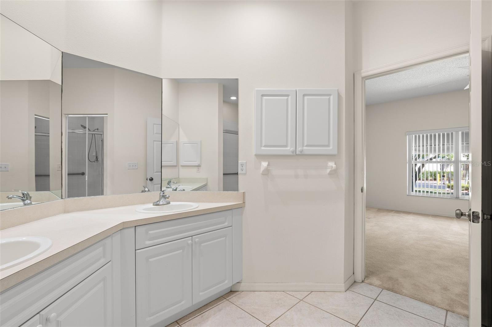 Well-connected primary bathroom with direct access to the bedroom, creating a practical and efficient suite layout.