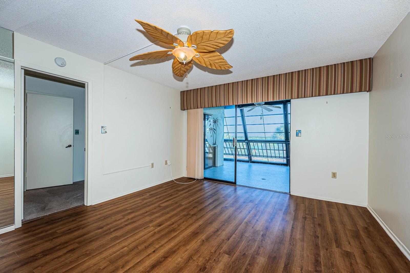 Living room area-sliders leading to the oversized balcony