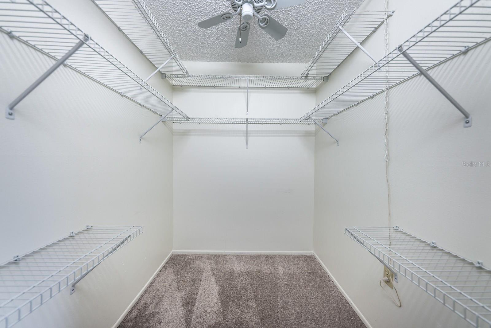 Walk in closet in primary bedroom