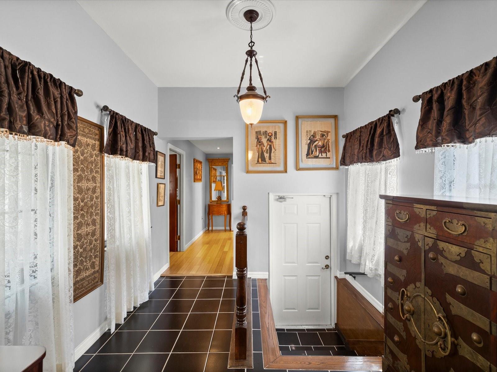 Hallway to primary suite 2, door to hangar