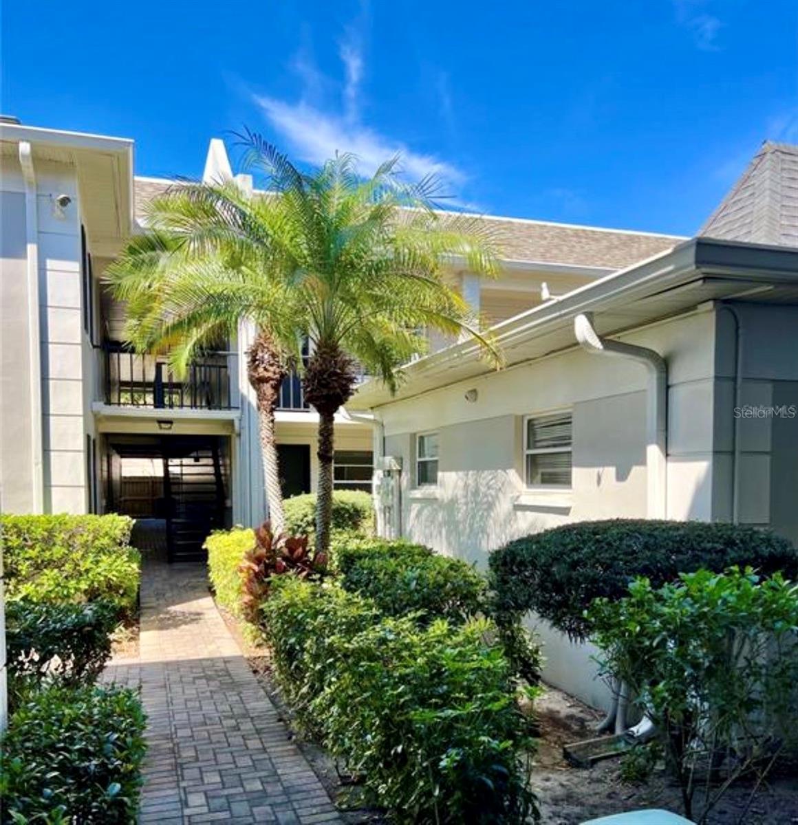 Lush, mature landscaping makes for a warm walk to the pool.