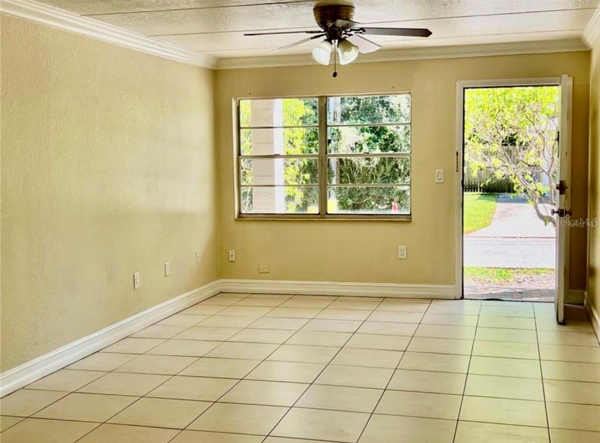 Living and dining areas and bedroom have crown molding for a finished and classic look.