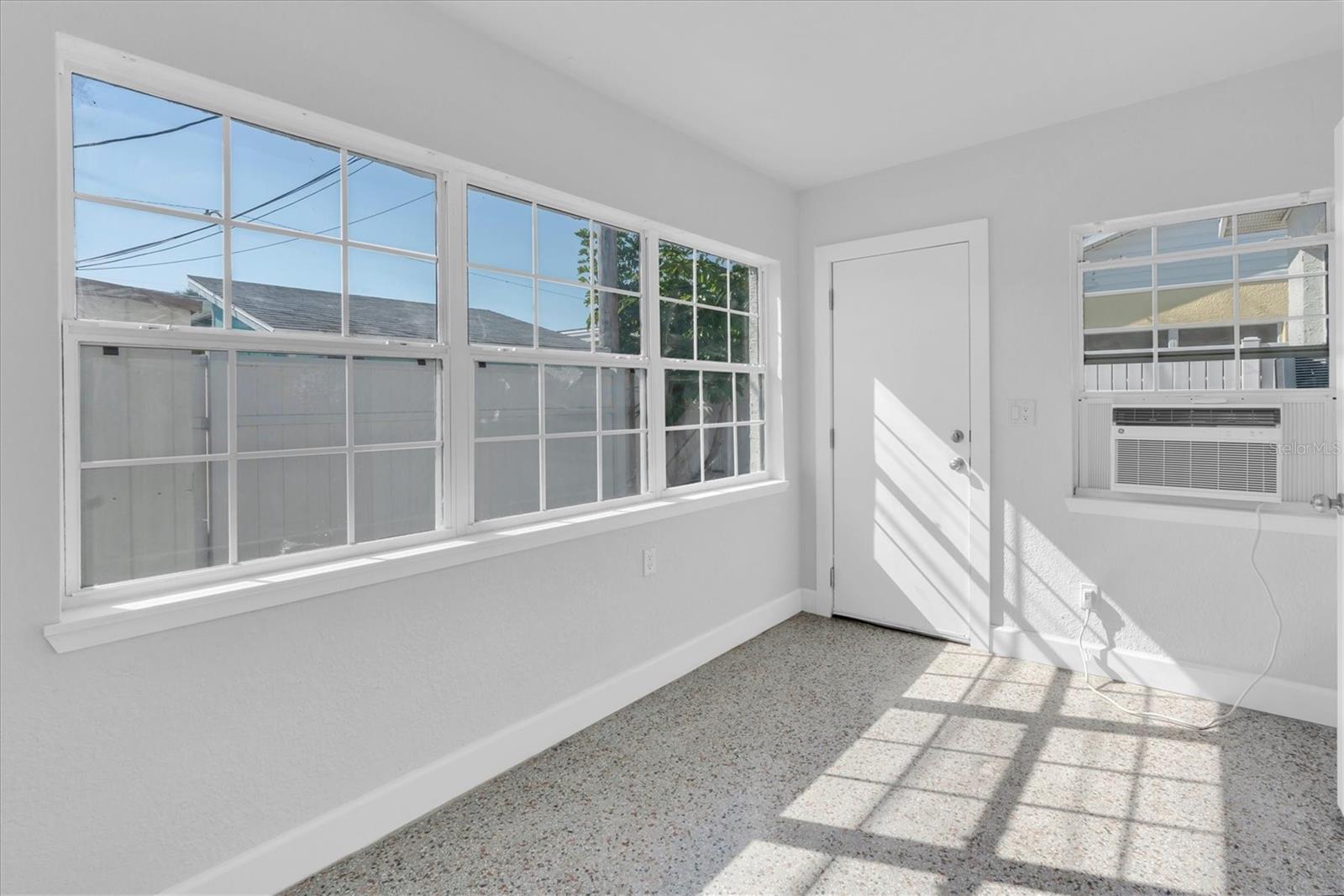 Bedroom 2 with lots of windows and Window unit- Right Side