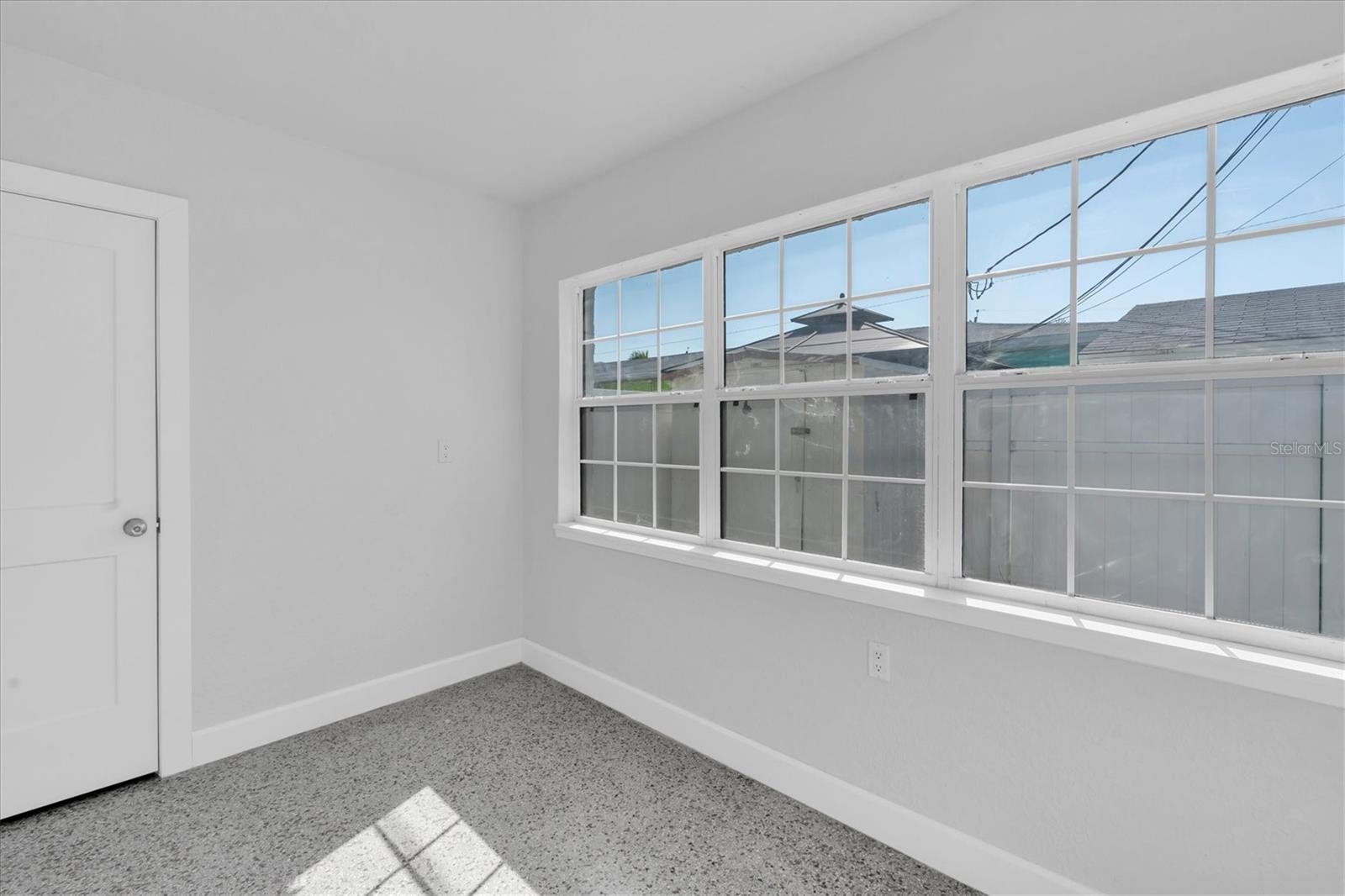 Bedroom 2 with lots of windows and Window unit- Right Side