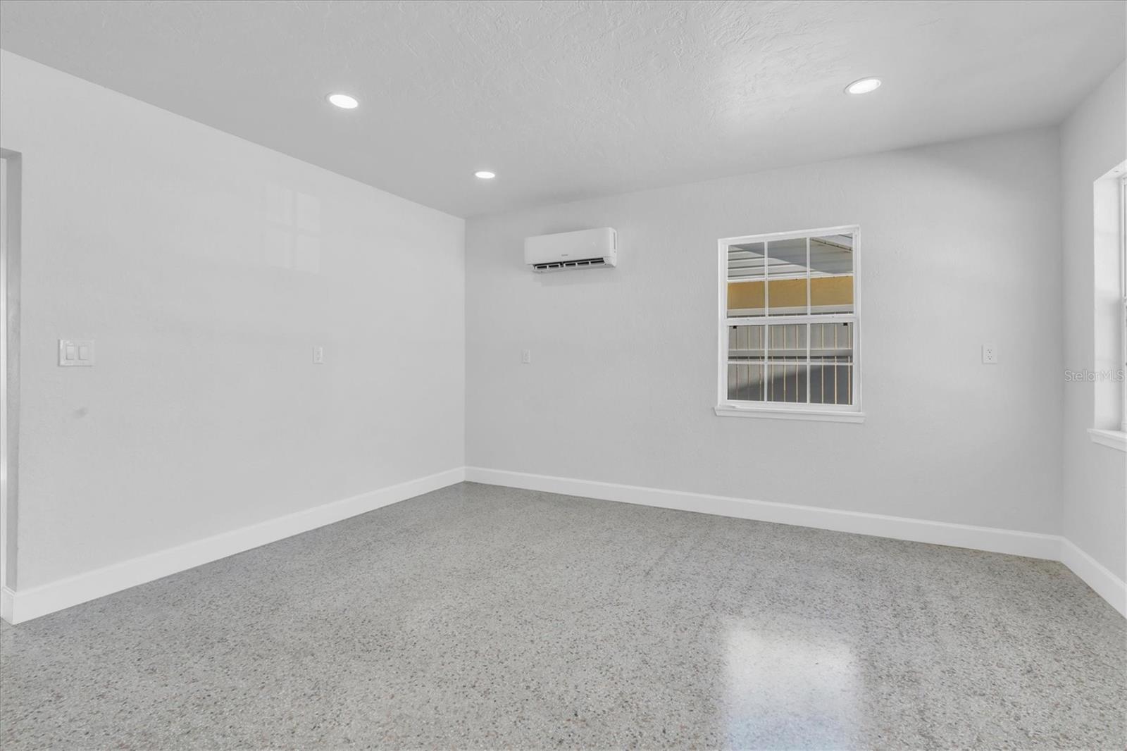 Living Area with mini split, recessed lighting, and Terrazo Floors - Right Side