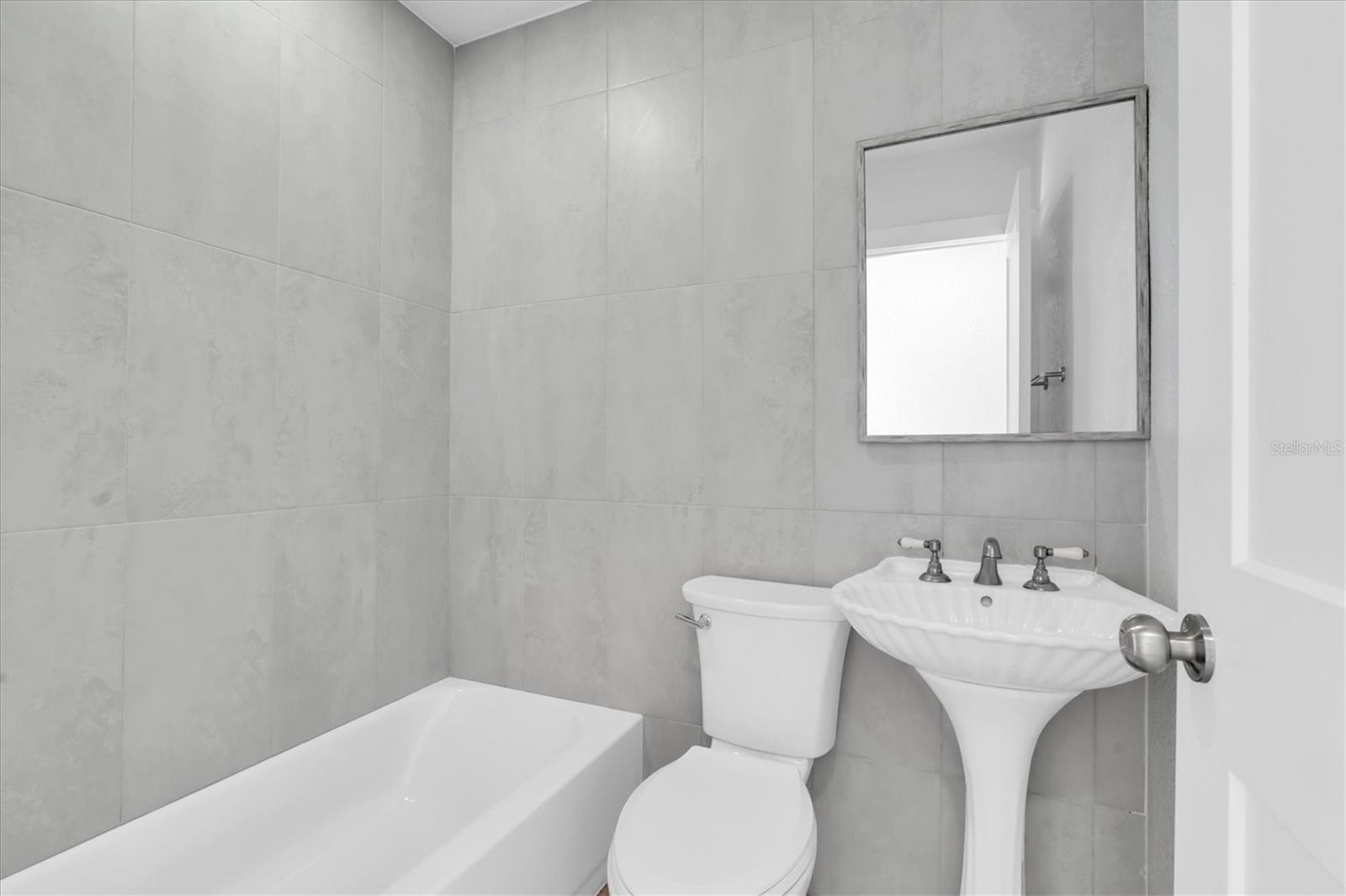 Newly Remodeled Tiled Bathroom Left Side