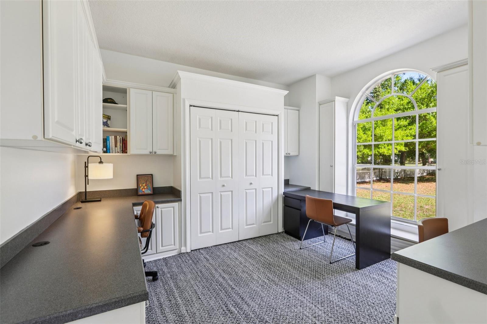 Office with closet and Built-In Desks and Cabinets