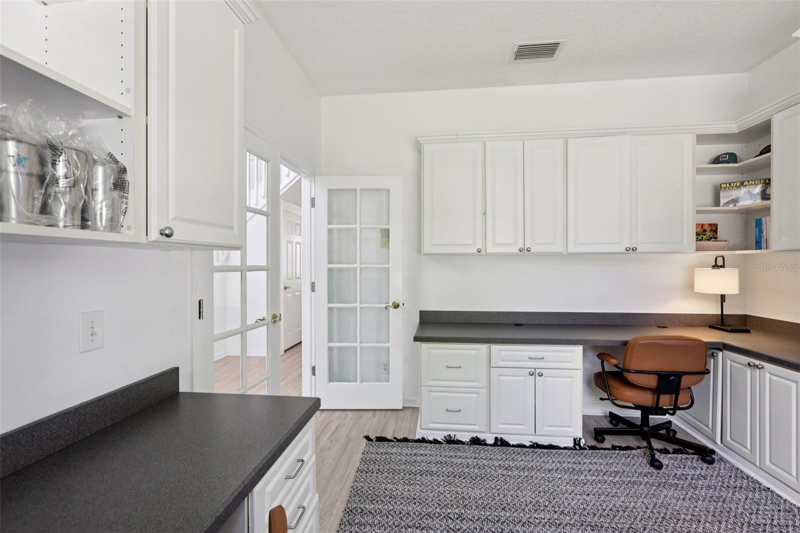 Office with closet and Built-In Desks and Cabinets