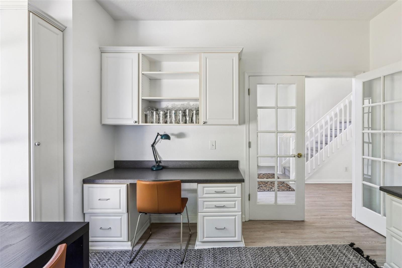 Office with closet and Built-In Desks and Cabinets