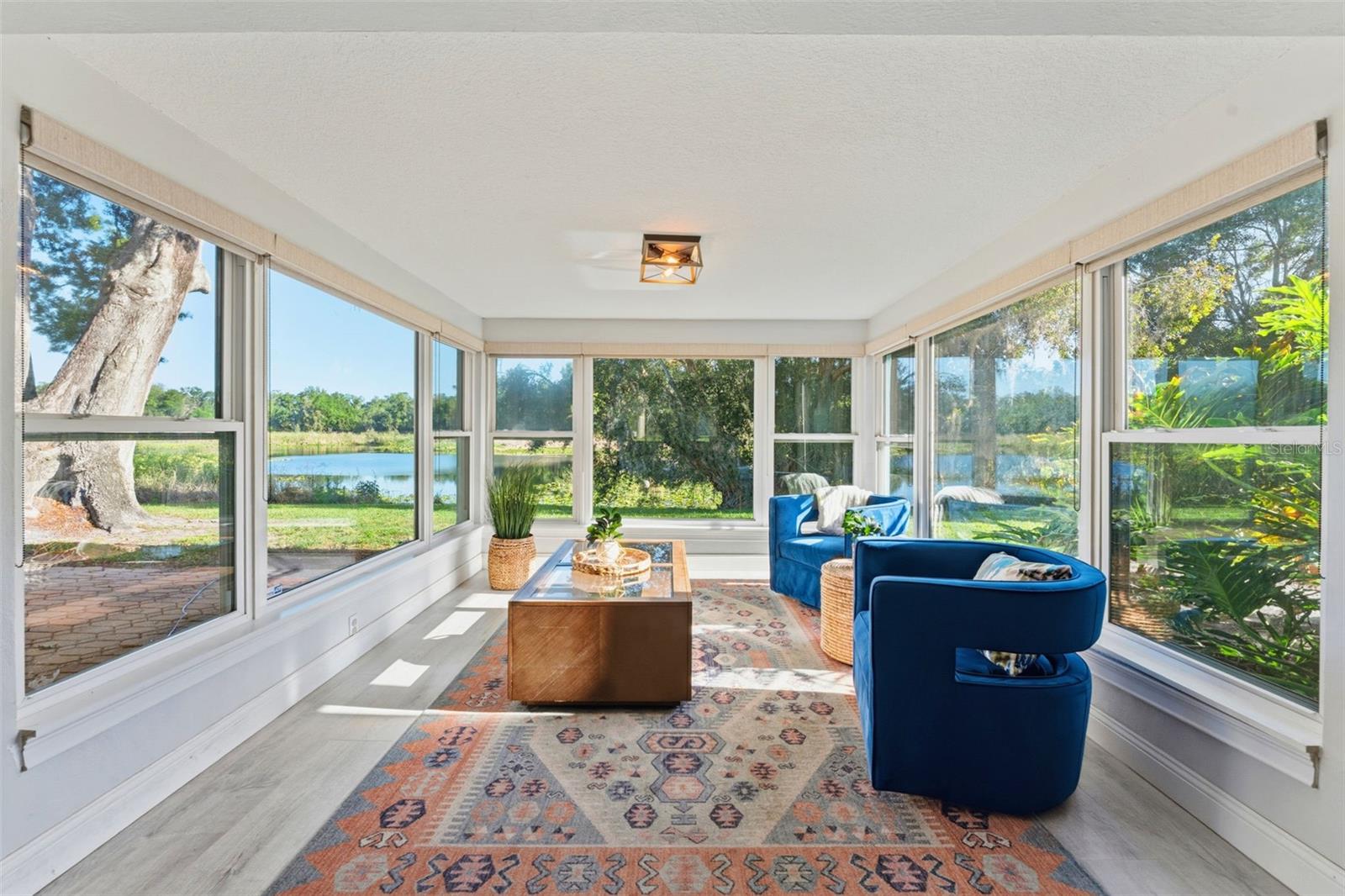 sip your coffee and watch the nature show from this sunroom!
