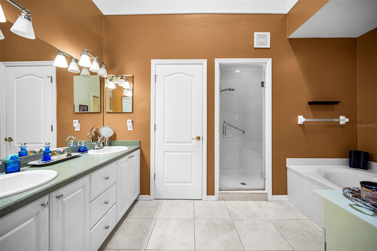 Primary bathroom with double sinks, garden tub and separate shower