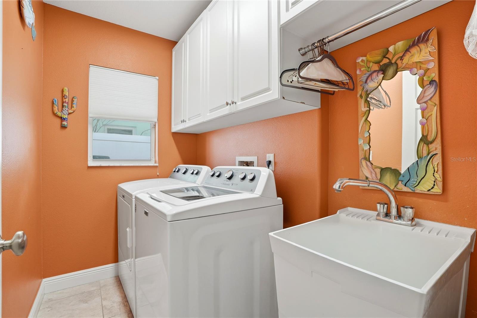 Indoor Laundry Room with Utility Sink and Storage