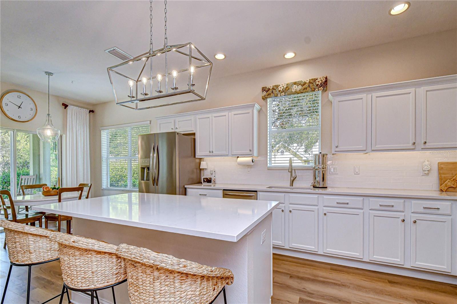 White cabinetry with crown molding.