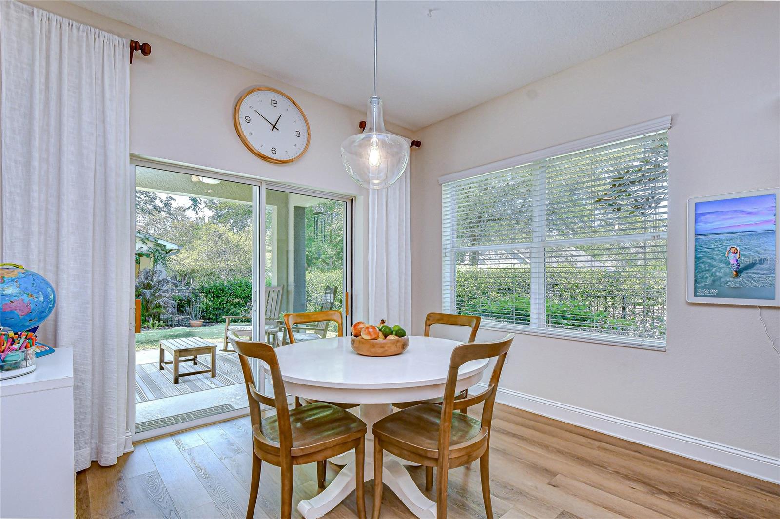 Bright dining nook with sliding doors to patio.