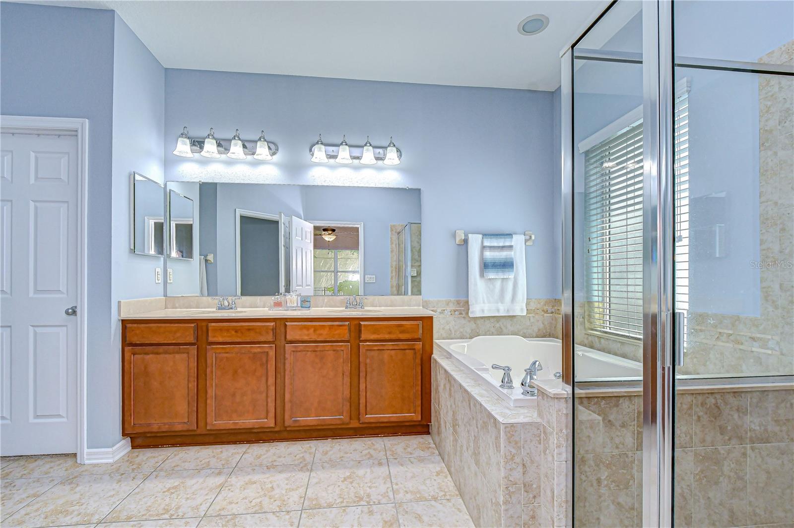 En-suite bath with dual sinks.