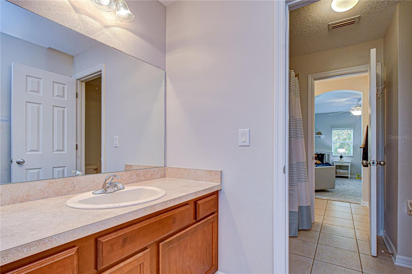 Shared bathroom between two bedrooms.