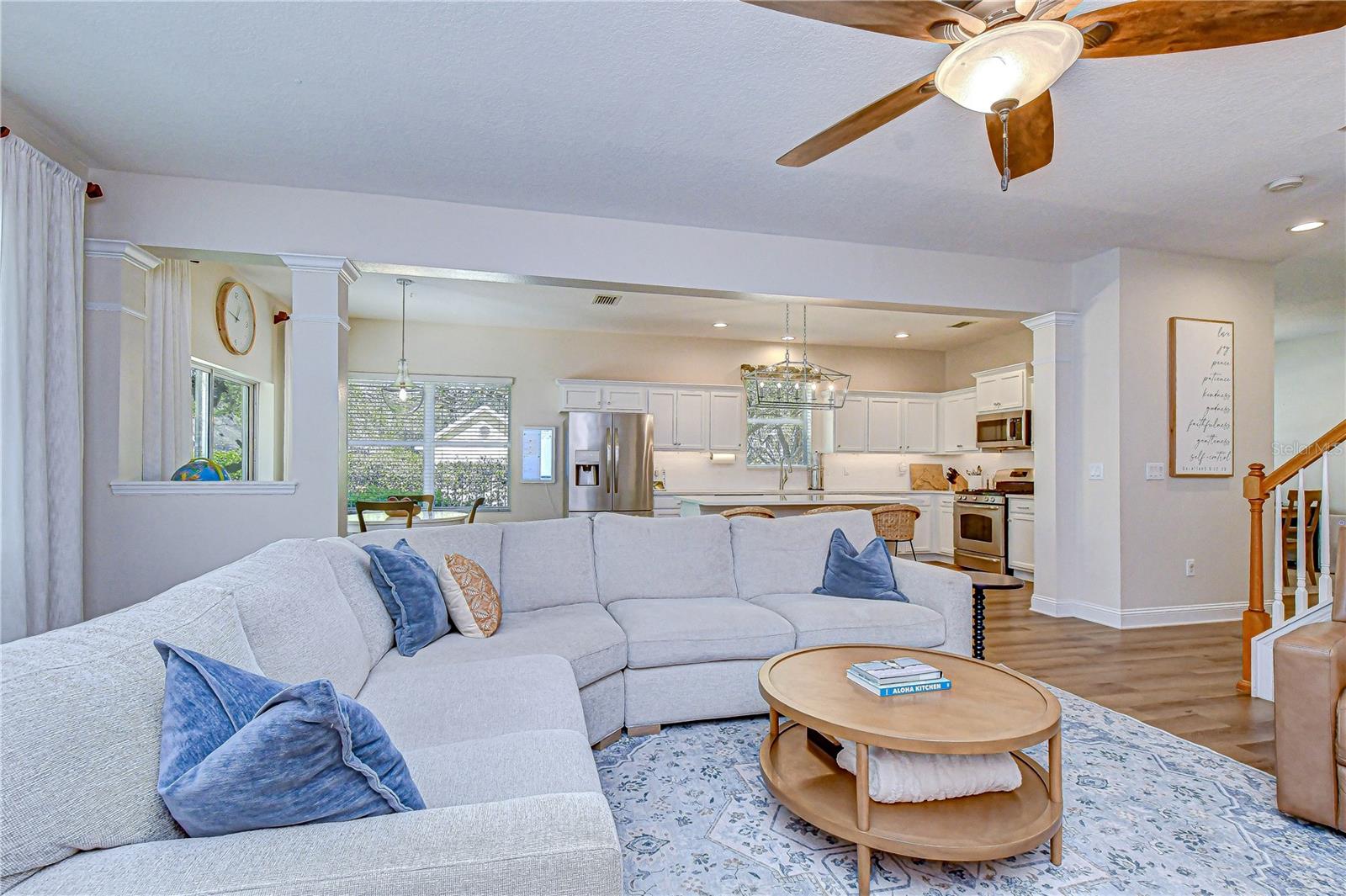 Large windows showcasing views of the fenced yard.