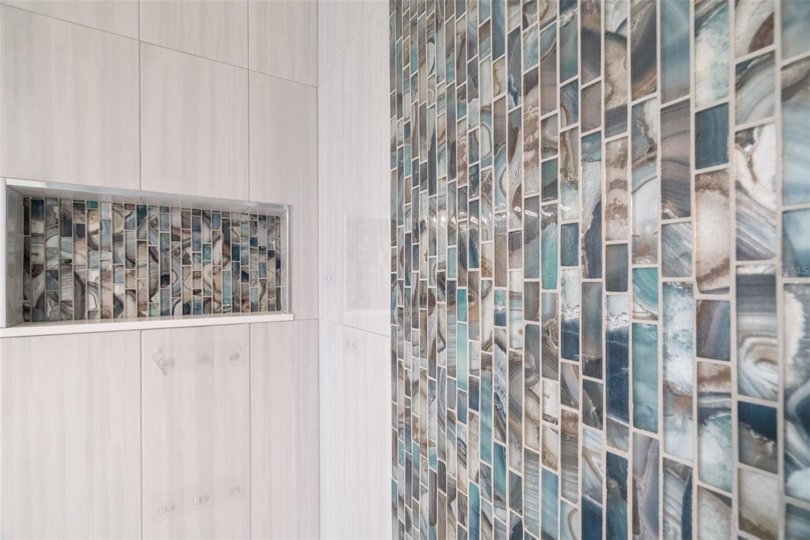 Trendy tilework in bathroom.