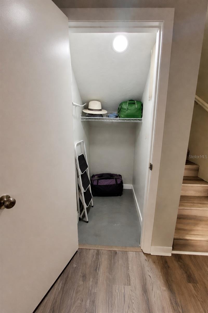 Walk in closet off kitchen area