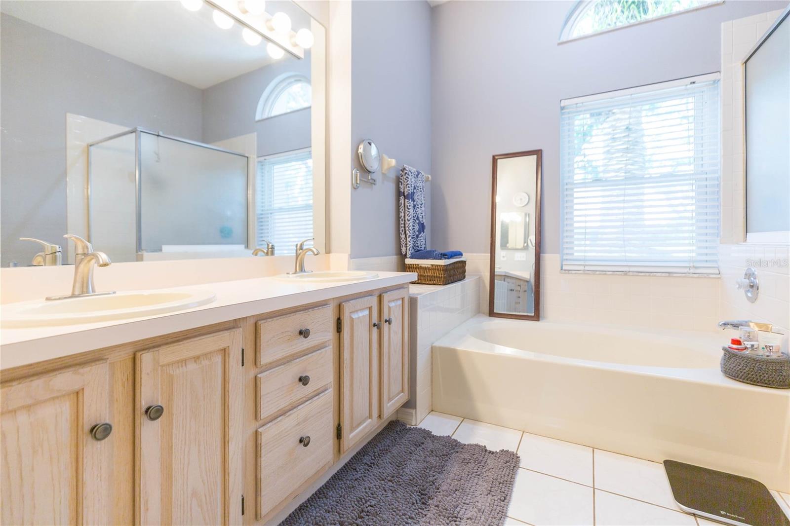 Primary bathroom with double sinks and soaking tub