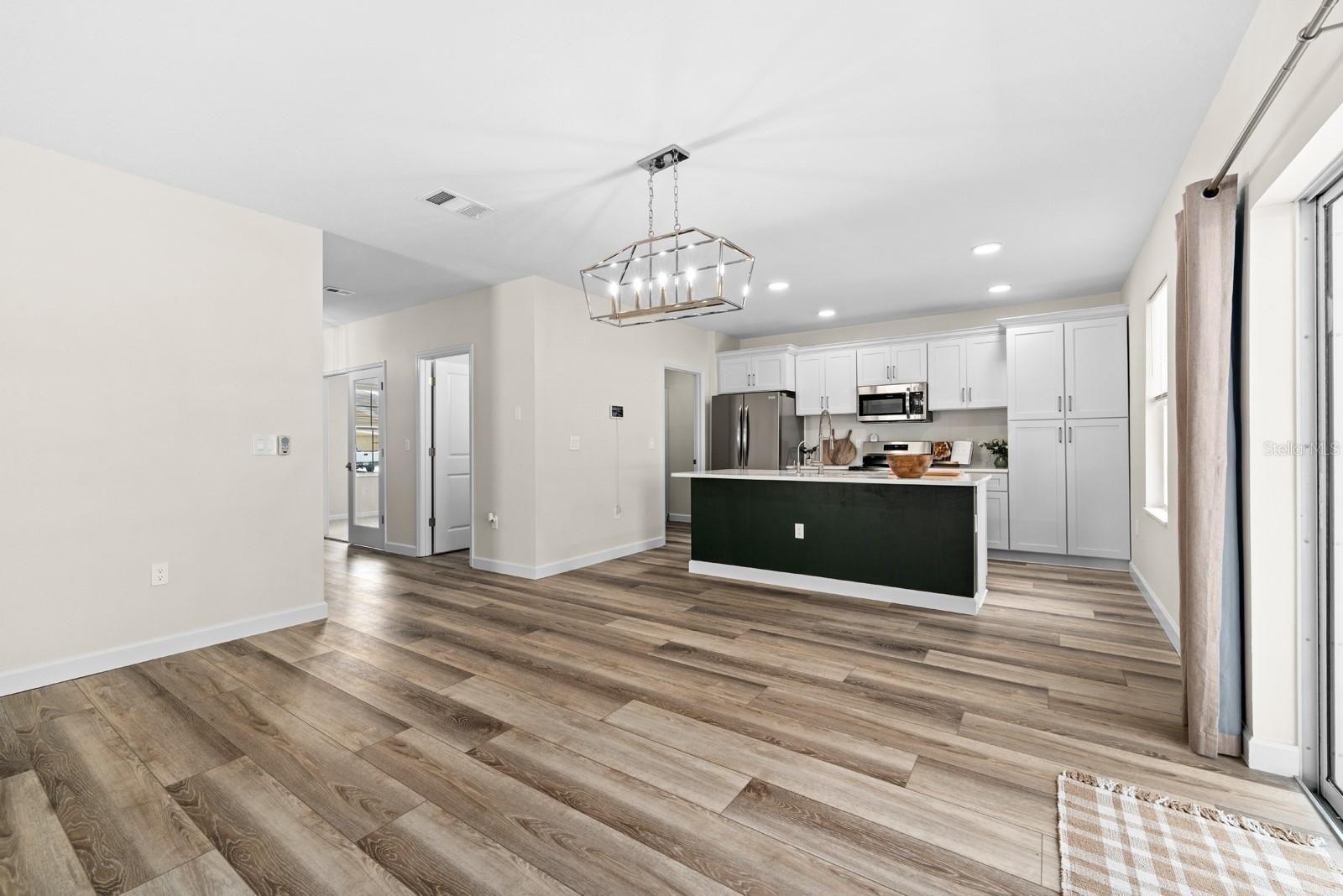 The Kitchen overlooks the large Living Room.