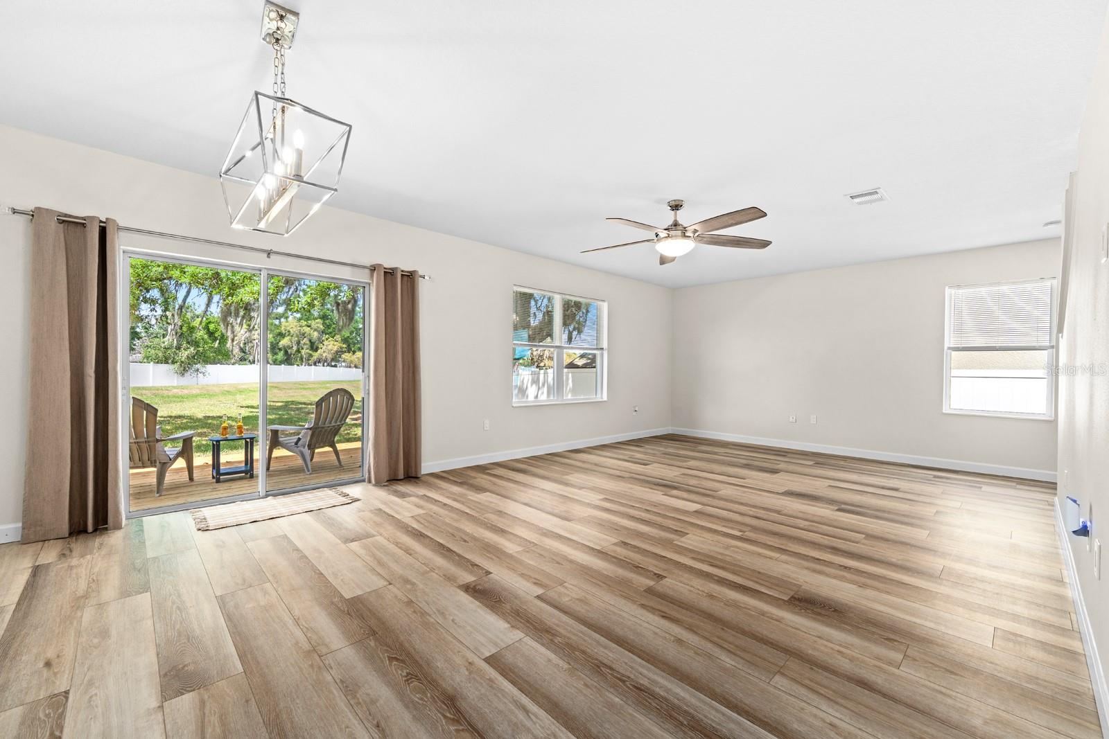 New Lighting, New LVP Flooring, New Curtains, Double-Paned Windows and Slider, New Ceiling Fan, New Window Blinds, New AC Vents