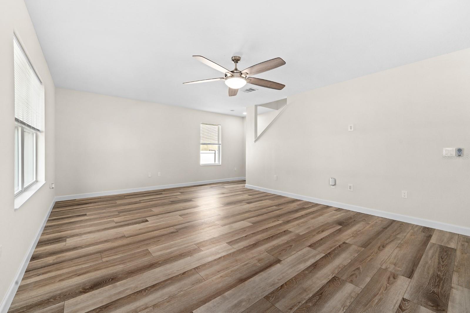 New Lighting, New LVP Flooring, New Curtains, Double-Paned Windows and Slider, New Ceiling Fan, New Window Blinds, New AC Vents