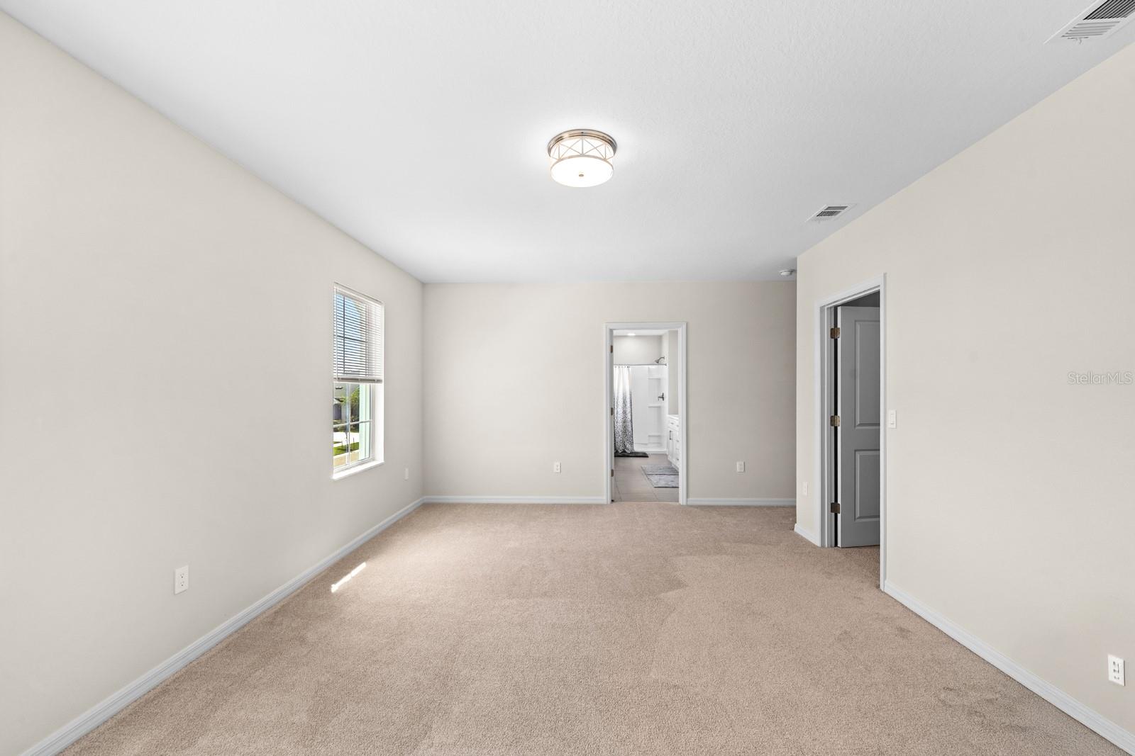 The En Suite is straight ahead, and the huge walk-in closet is to the right.