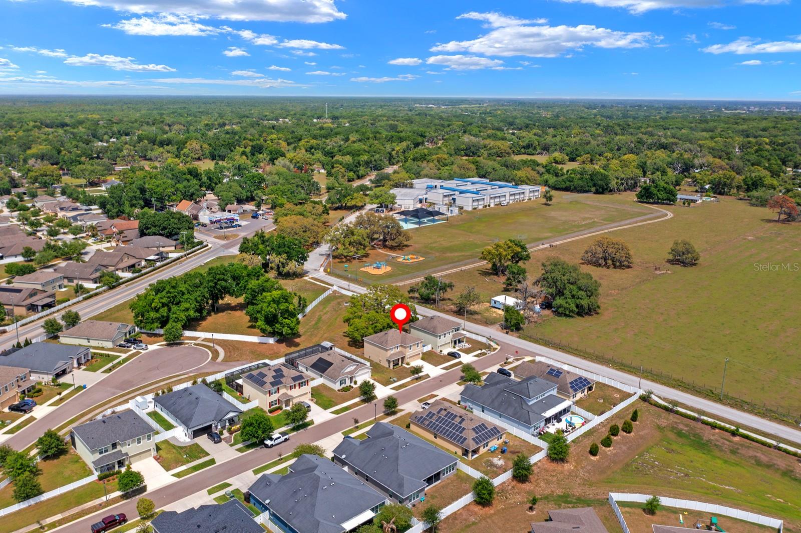 The field on the right side of the photo is a cow pasture, and you can hear the cows mooing in the late afternoon. Folsom Elementary School (grey and blue buildings) is just a 5-minute walk.