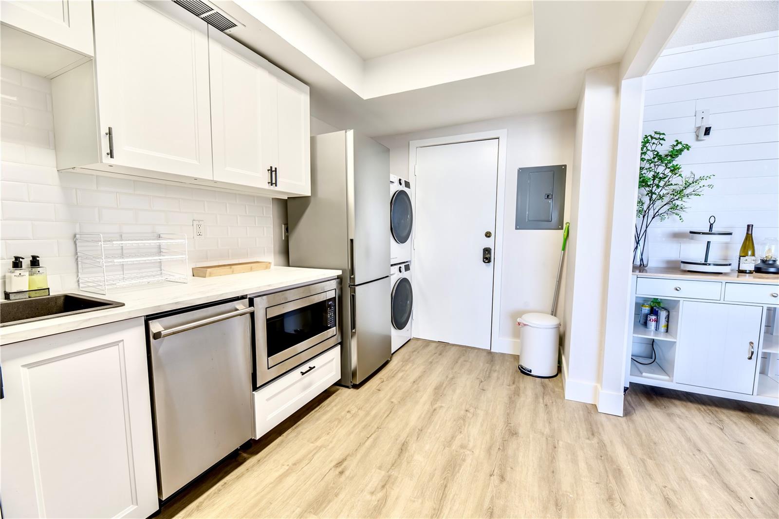 Solid Wood Cabinets, Quartz Countertops, Stainless Steel Dishwasher, Microwave, Refrigerator, Stacked W& D, 2nd Door Exit