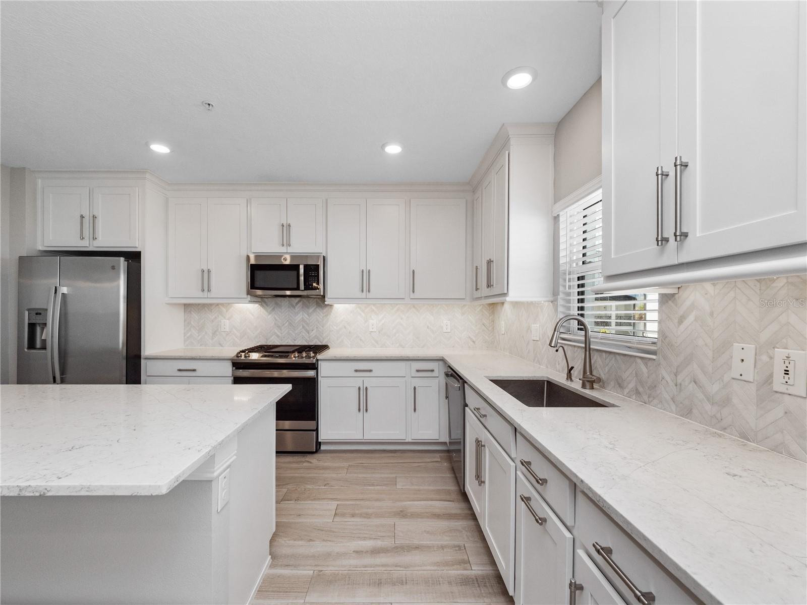 Upgrades galore! Appliances, stone counter tops, marble backsplash!