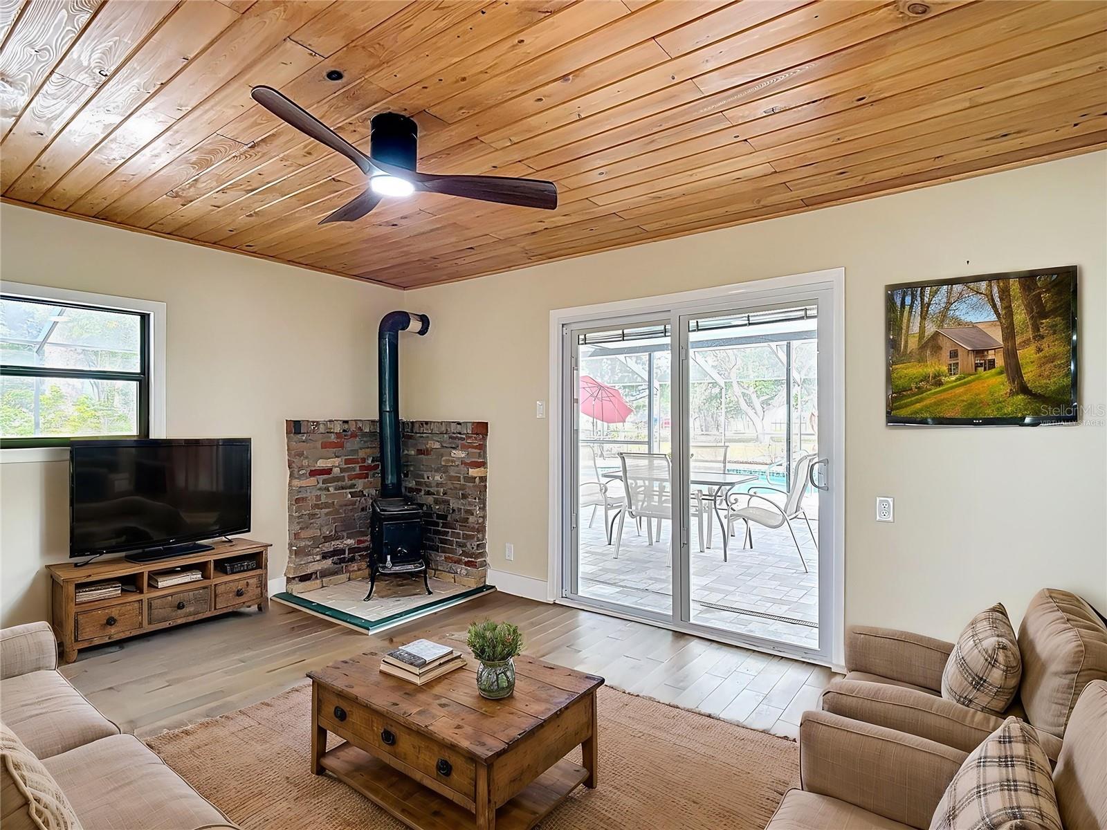 Virtually staged Gathering area overlooking pool/spa