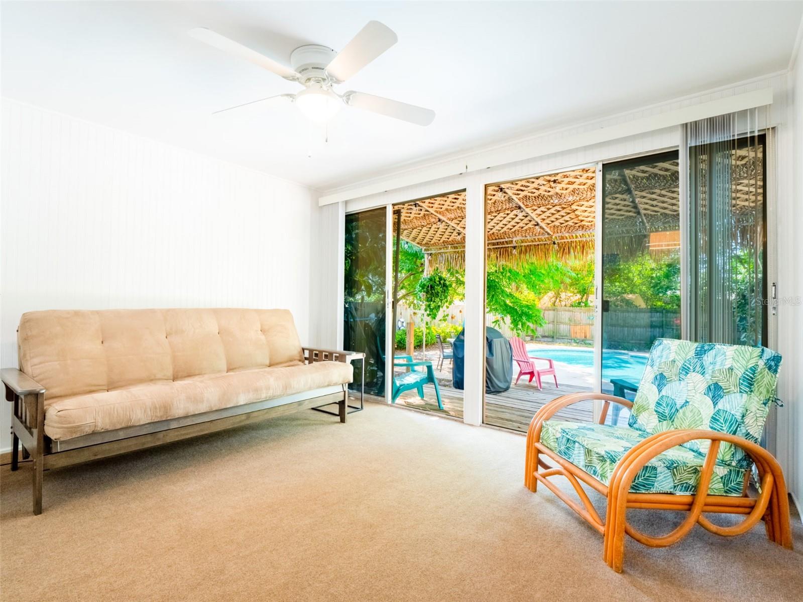 Flexible bonus room space with sliding glass doors leading outside