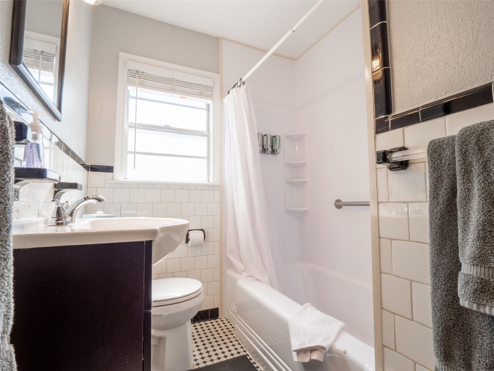 Hall bathroom features a tub/shower combo