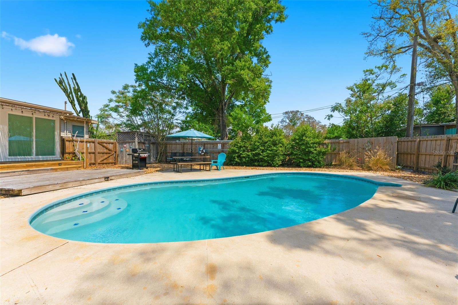 Your own private backyard oasis featuring a spacious kidney-shaped pool—perfect for relaxing or entertaining year-round.