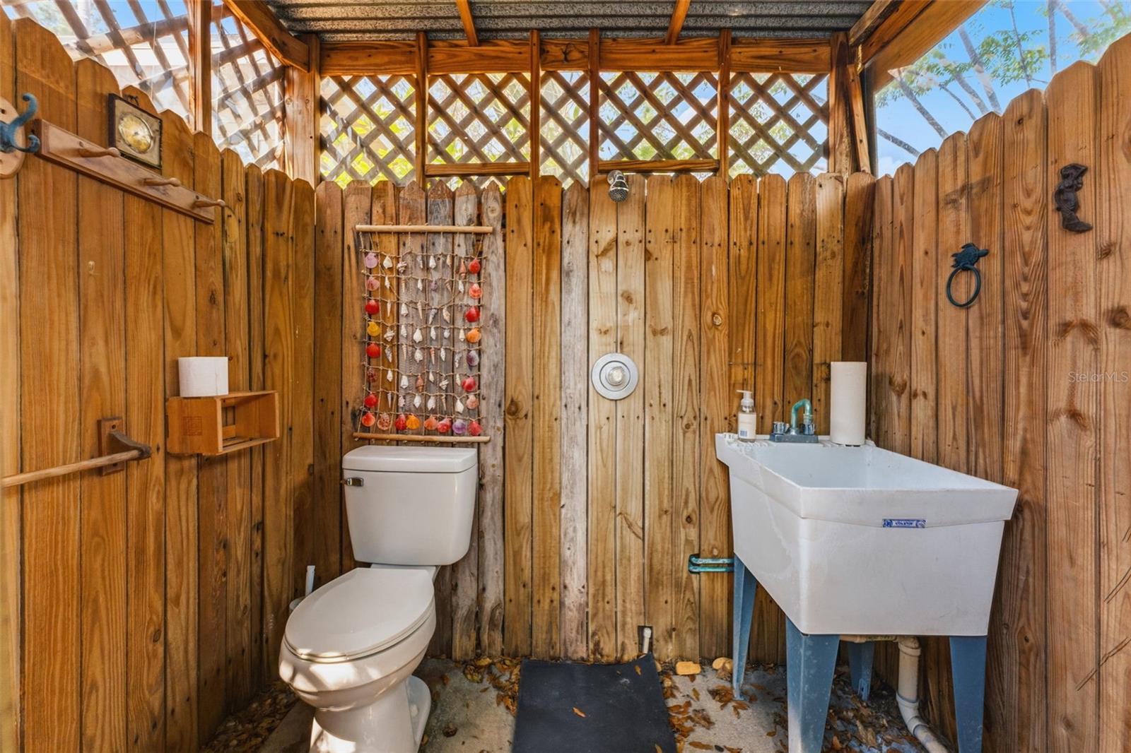 Convenient and private, the detached outdoor bathroom keeps you comfortable while enjoying your pool and backyard oasis.