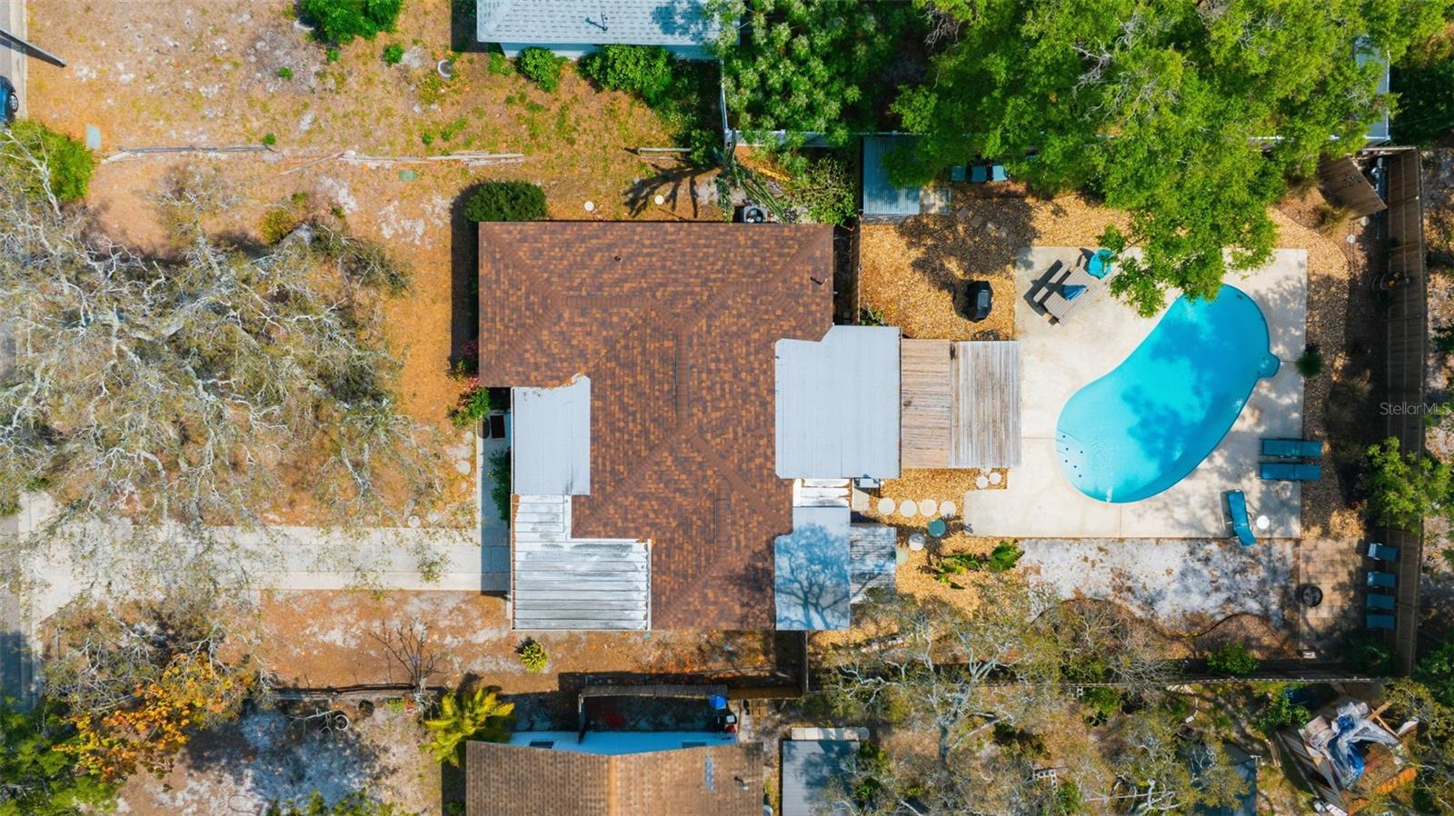 A stunning aerial view capturing the full beauty of the home and your private backyard oasis.
