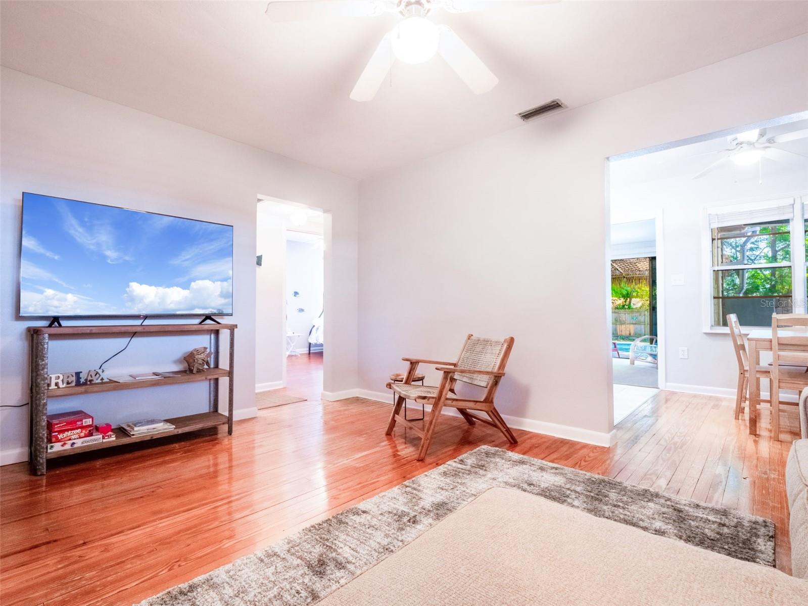 Living room view to dining area and hallway