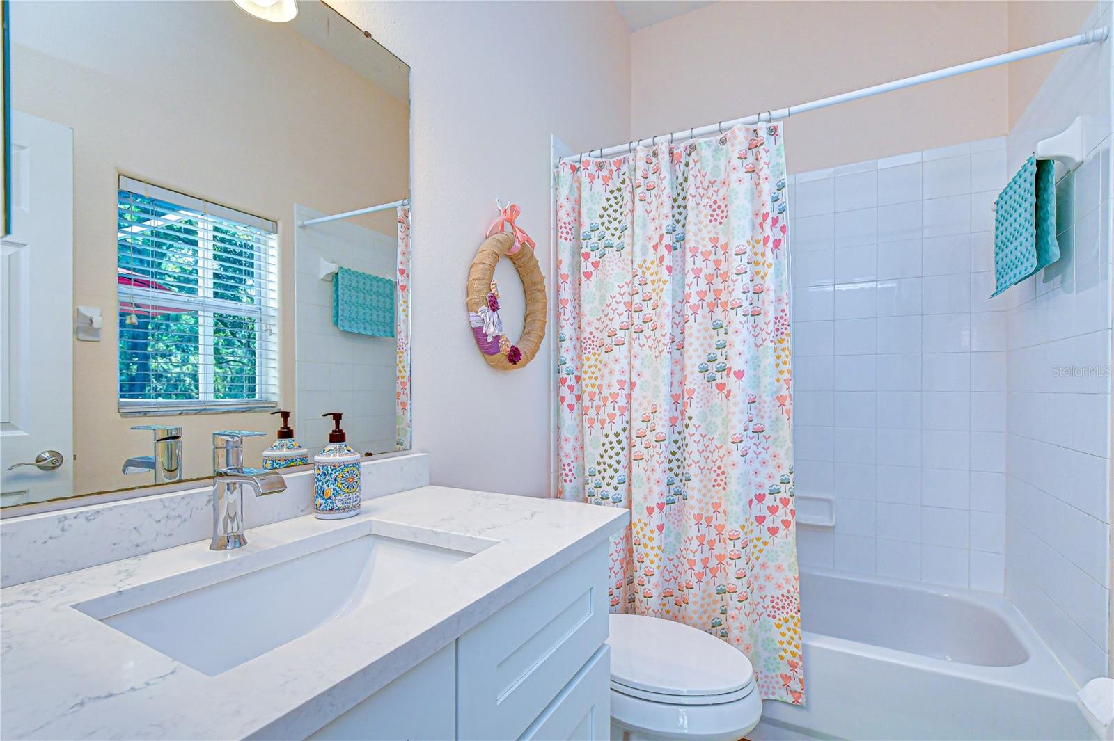 Full bath conveniently positioned for guest use