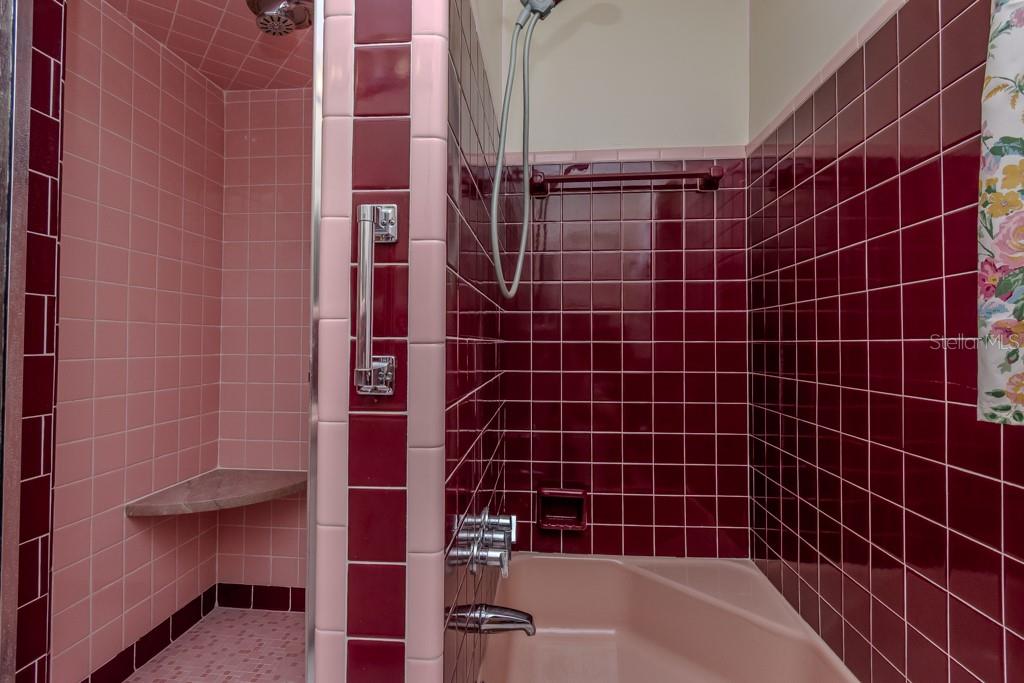 DOUBLE SHOWER STALLS - STALL ON RIGHT HAS SHORT TUB
